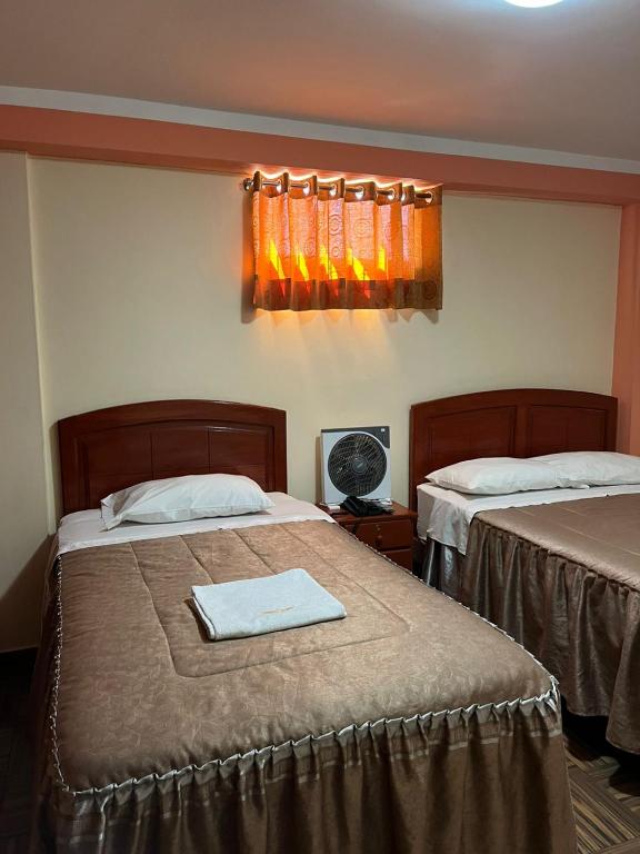 Postel nebo postele na pokoji v ubytování Hotel lucero real
