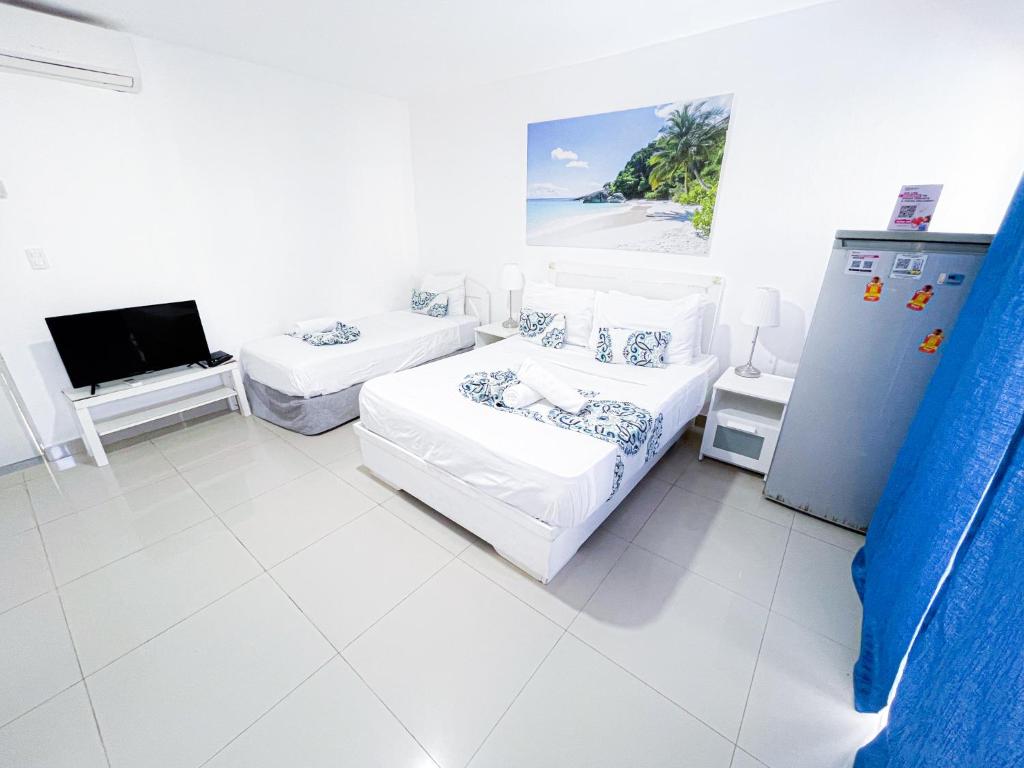 Postel nebo postele na pokoji v ubytování TROPICAL ADVENTURE SOL CARIBE Studios POOL SUITES Beach CLUB & SPA