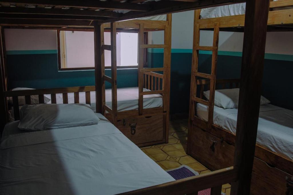Postel nebo postele na pokoji v ubytování santo hostel parati