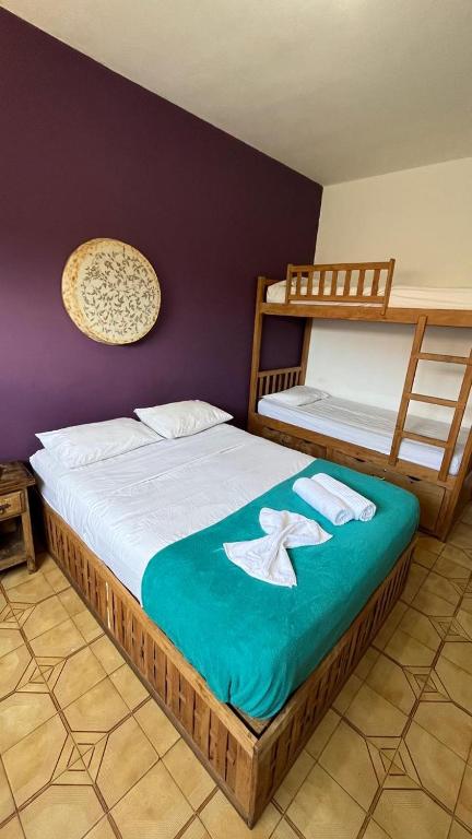 Postel nebo postele na pokoji v ubytování santo hostel parati