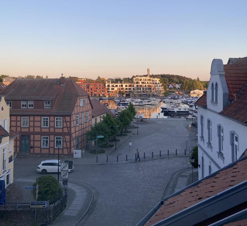 a view of a city with buildings and a street at De Lütte Nest in Waren