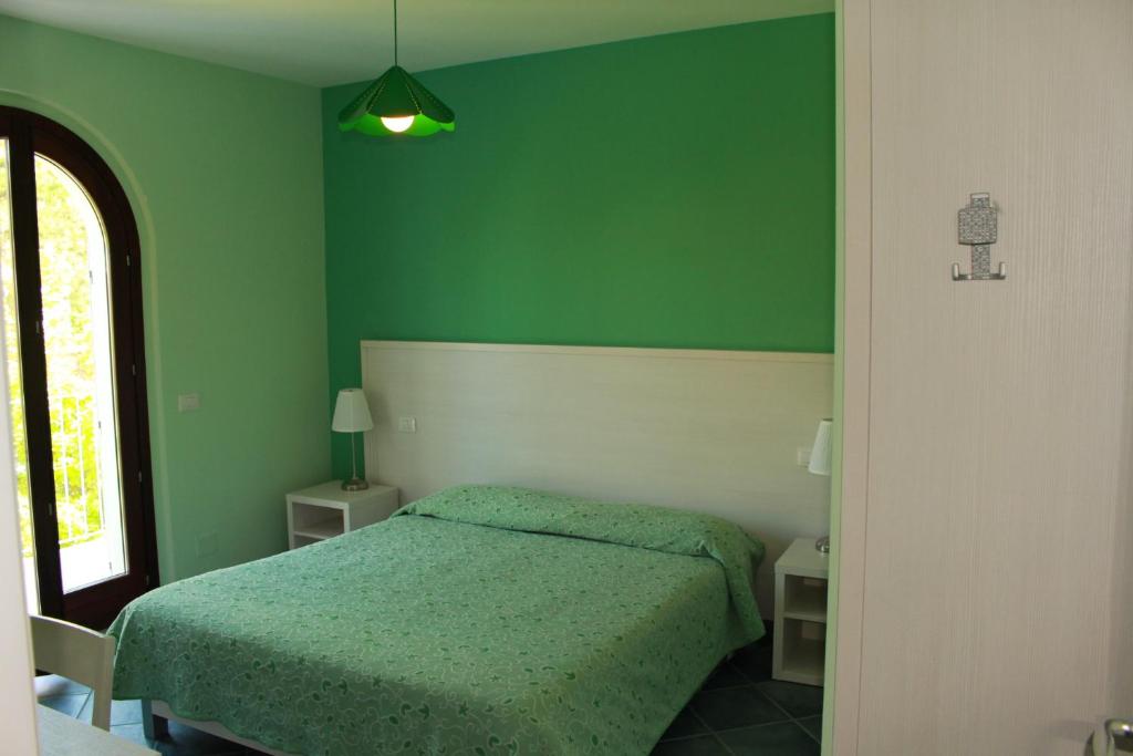 Postel nebo postele na pokoji v ubytování La Piazzetta Affittacamere B&B