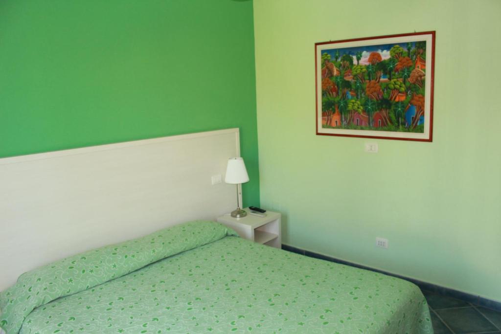 Postel nebo postele na pokoji v ubytování La Piazzetta Affittacamere B&B