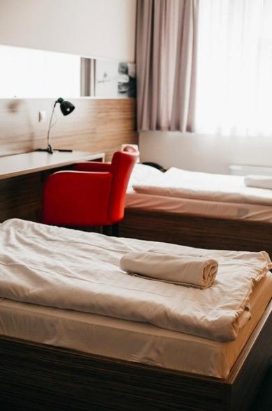 Postel nebo postele na pokoji v ubytování Hotelik Košice