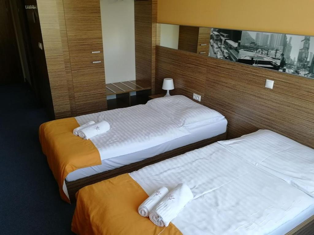 Postel nebo postele na pokoji v ubytování Hotelik Košice