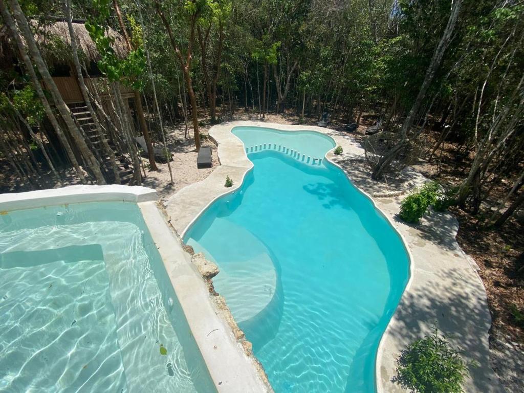 Bazén v ubytování Aldea Maya-Ha Cabañas con cenotes nebo v jeho okolí