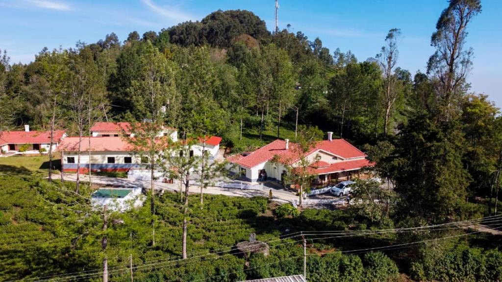 an aerial view of a house on a hill at Karuniagiri Guest House in Jāmb