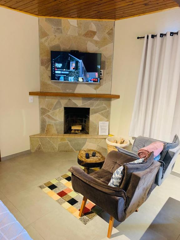 TV a/nebo společenská místnost v ubytování Chalé Vista Verde