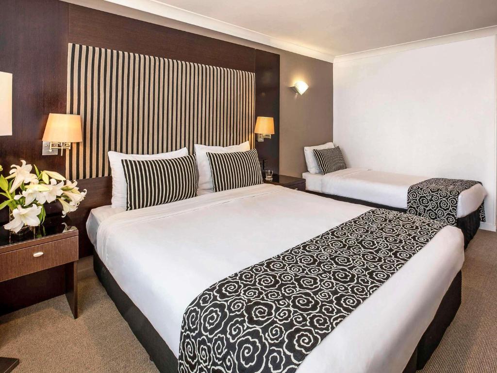Postel nebo postele na pokoji v ubytování Mercure Wellington Abel Tasman