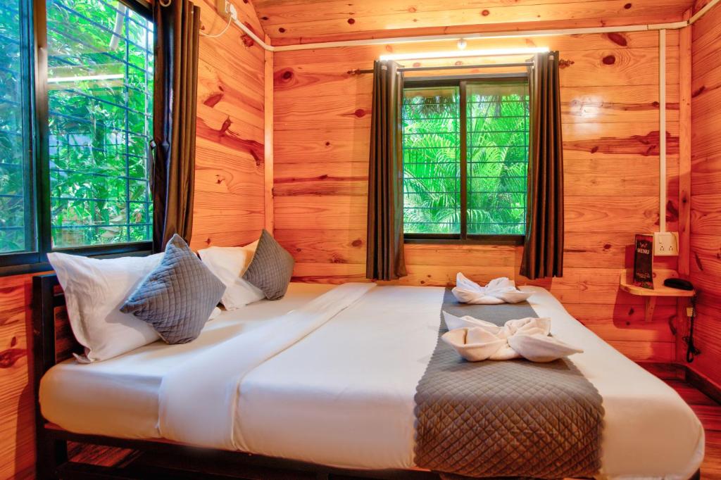 Postel nebo postele na pokoji v ubytování The Lazy Cabanas