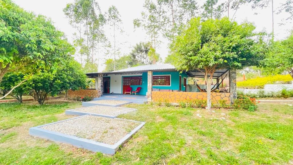 a small house with a blue at Villanueva Casanare Country House in Villanueva