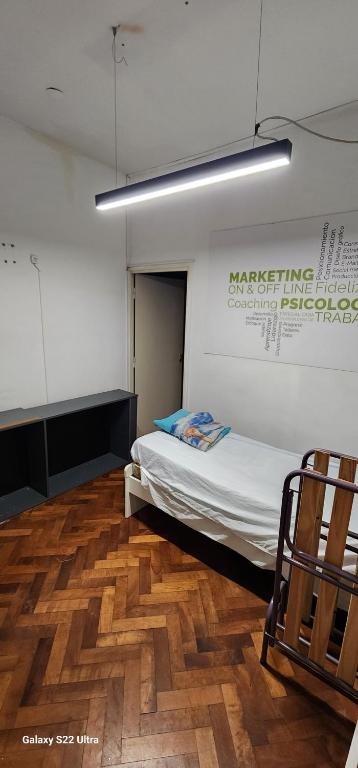 a room with a bed and a chair in it at Hospedaje reconquista in La Porteña