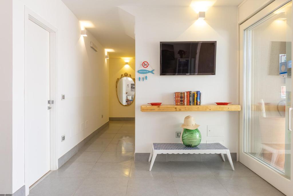 TV a/nebo společenská místnost v ubytování Domu Ajaju Guest House