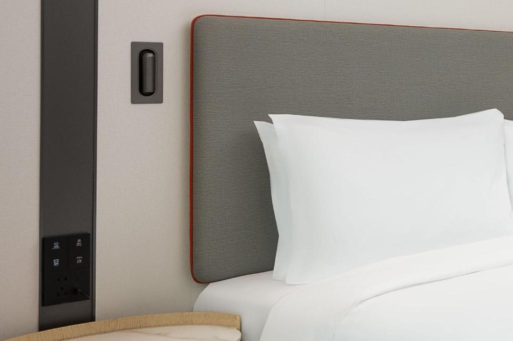 Postel nebo postele na pokoji v ubytování Holiday Inn Express Shanghai Hongqiao CBD by IHG