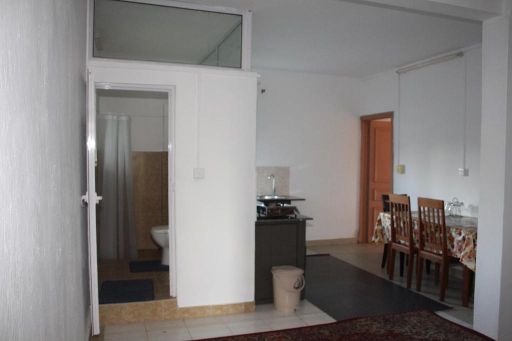 Bano Tourist Residence - 650 meters from Grand Bay Beach - Habitación Doble Con Baño Privado