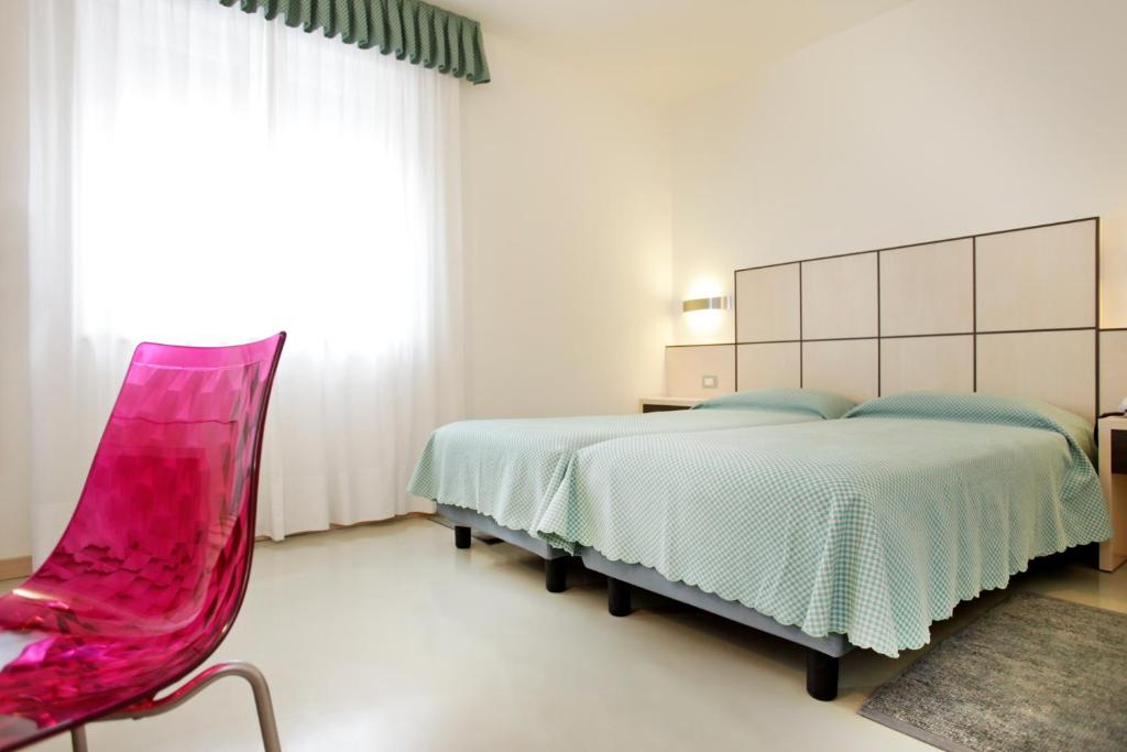 Postel nebo postele na pokoji v ubytování Hotel Miorelli