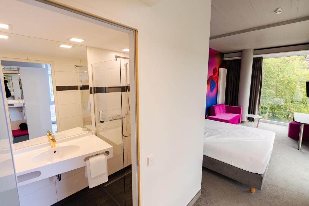 Koupelna v ubytování qubixx stadtmittehotel