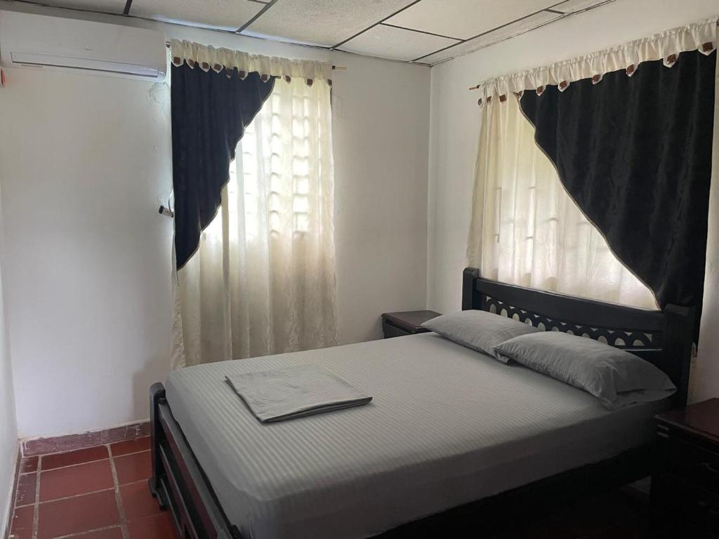 Postel nebo postele na pokoji v ubytování Apartamentos Poseidon