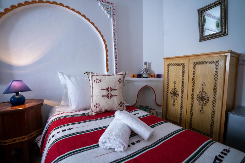 Postel nebo postele na pokoji v ubytování Dar AL BARAKA
