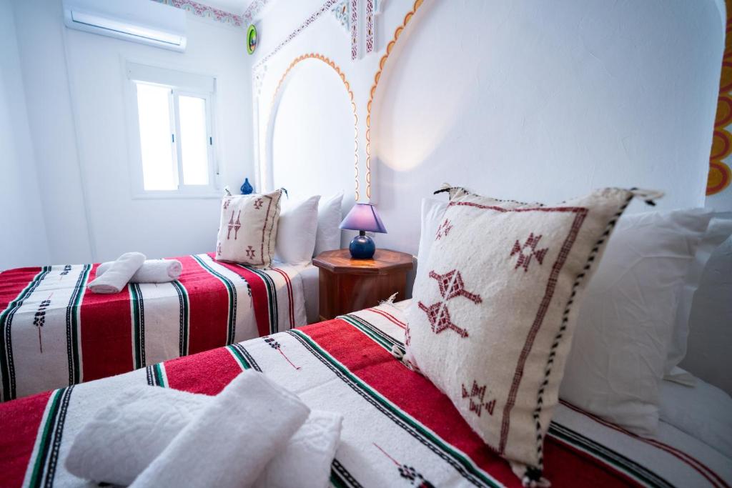 Postel nebo postele na pokoji v ubytování Dar AL BARAKA