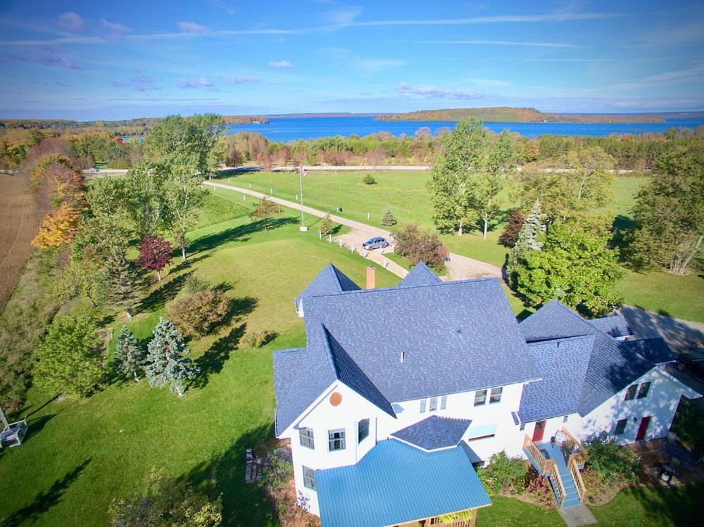 an overhead view of a house with a blue roof at Twin Peaks B&B in Mindemoya