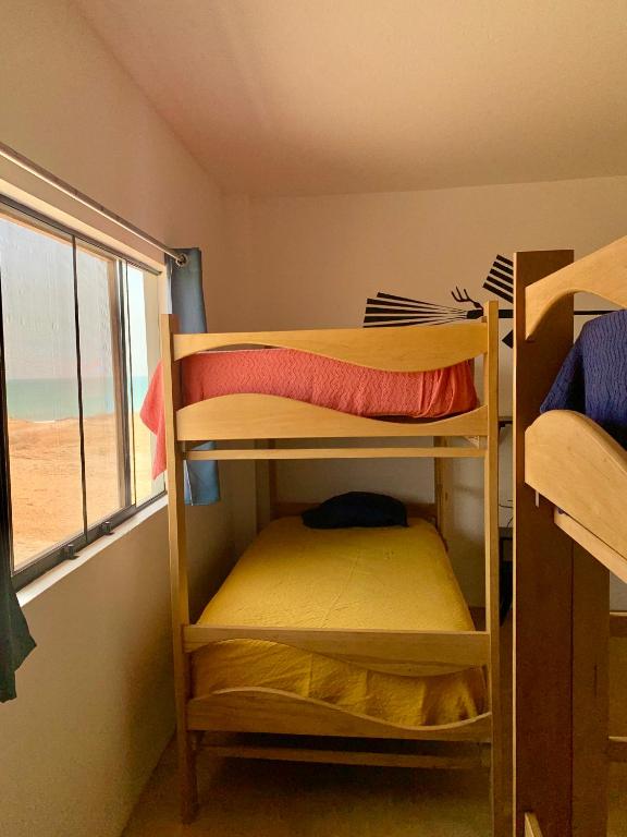 Postel nebo postele na pokoji v ubytování Tayta Surf House