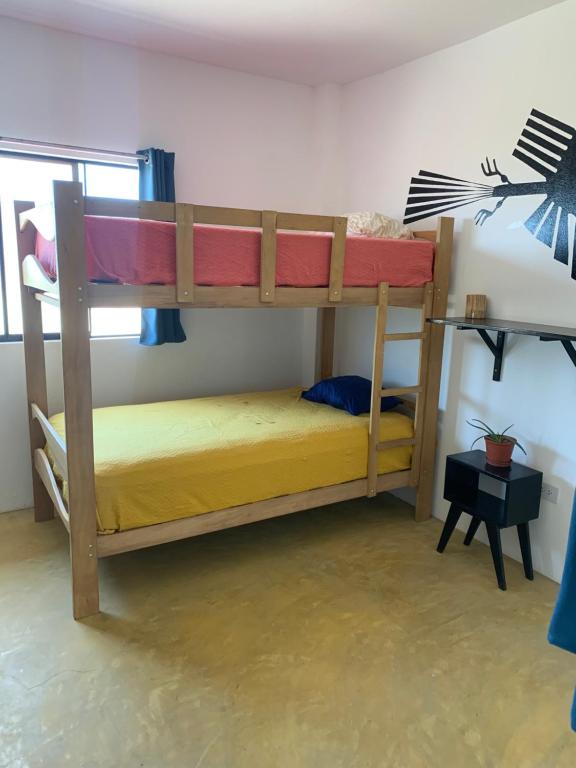 Postel nebo postele na pokoji v ubytování Tayta Surf House