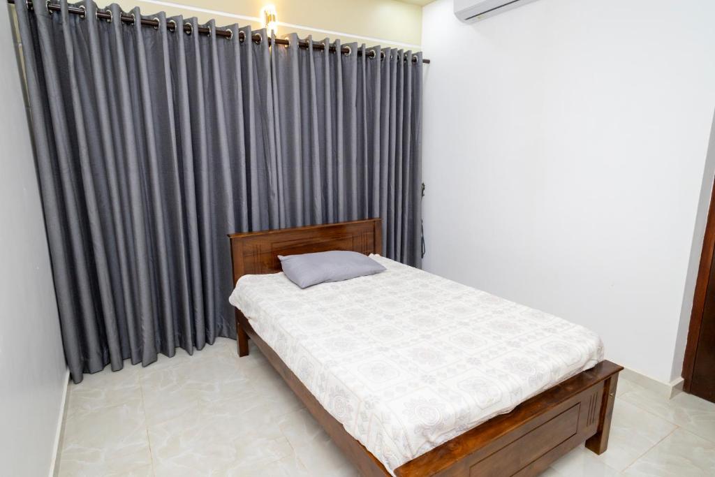 Postel nebo postele na pokoji v ubytování Sri Pool Villa - Jaffna