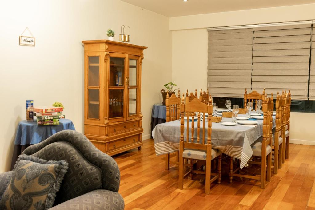 a dining room with a table and chairs at Tower Center Apartment in La Paz