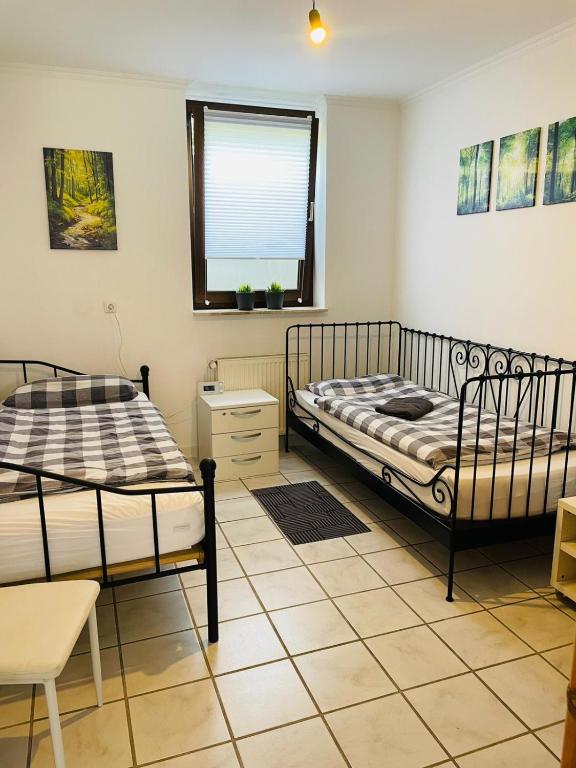 Postel nebo postele na pokoji v ubytování Monteurzimmer