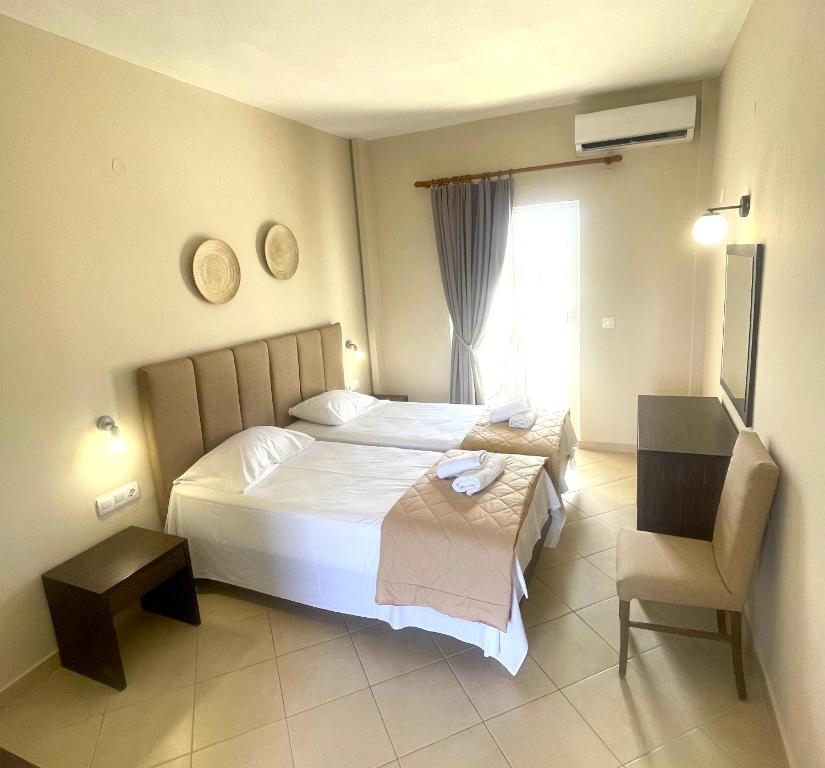 Postel nebo postele na pokoji v ubytování Oasis Beach Club