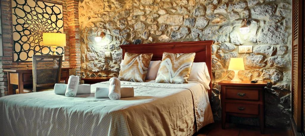 A bed or beds in a room at El Juacu