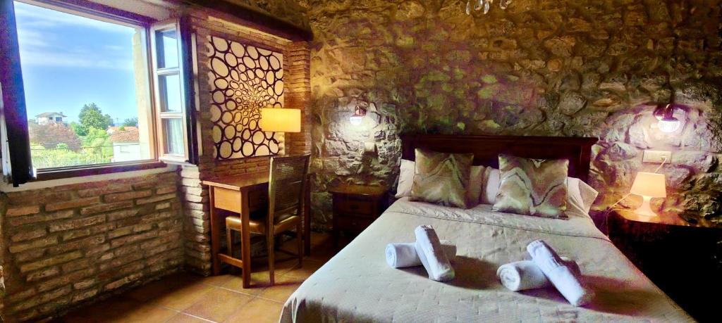 A bed or beds in a room at El Juacu