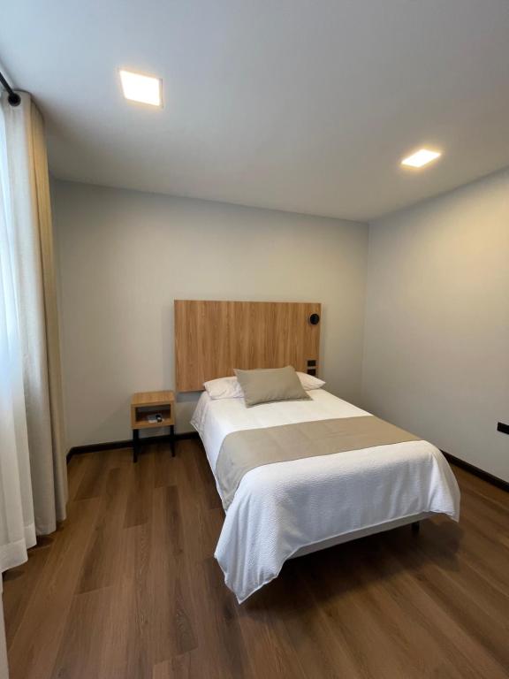 Postel nebo postele na pokoji v ubytování Universitario Hotel