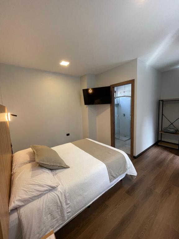 Postel nebo postele na pokoji v ubytování Universitario Hotel