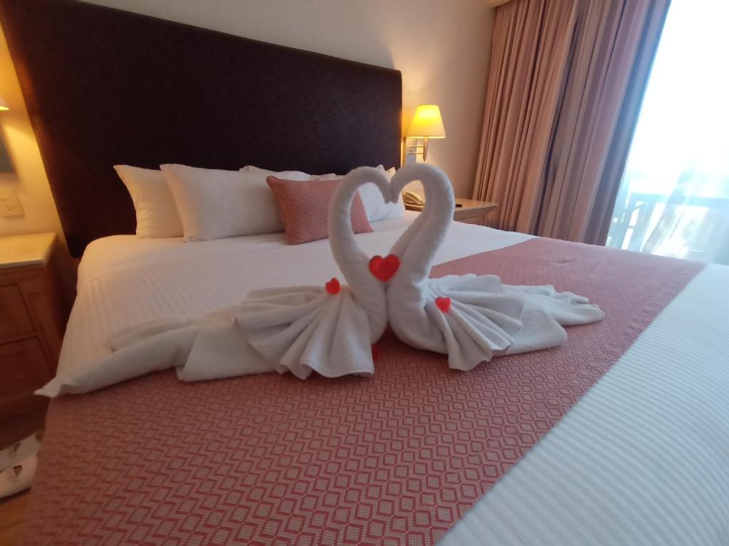 Postel nebo postele na pokoji v ubytování Hotel Palacio Azteca