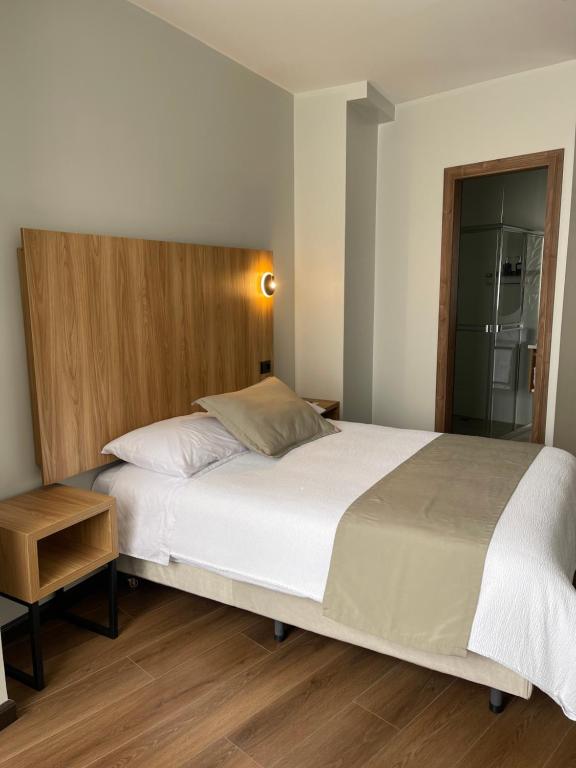 Postel nebo postele na pokoji v ubytování Universitario Hotel
