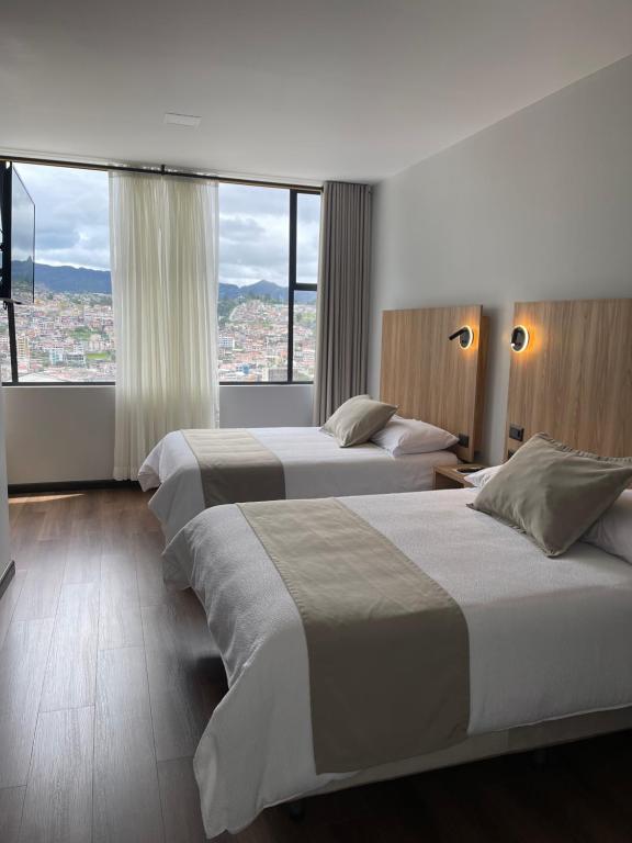 Postel nebo postele na pokoji v ubytování Universitario Hotel