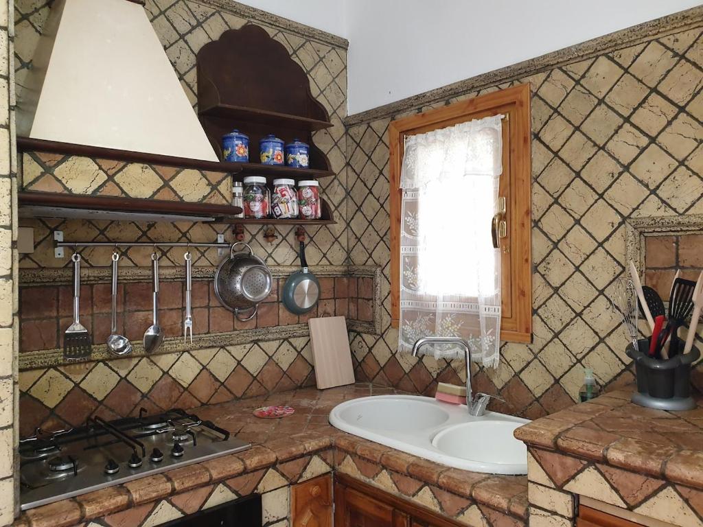 Nhà bếp/bếp nhỏ tại Villetta Mare Australe