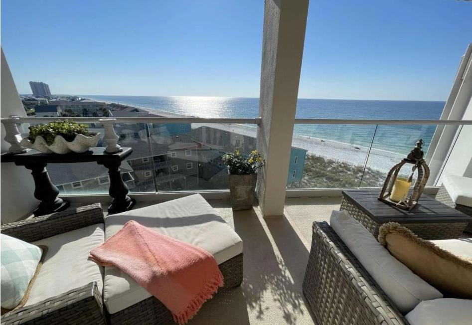 a living room with a view of the beach at Regency Towers Unit 803E in Pensacola Beach