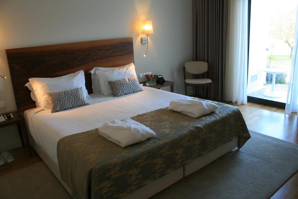 Uma cama ou camas num quarto em Convento Da Serta Hotel