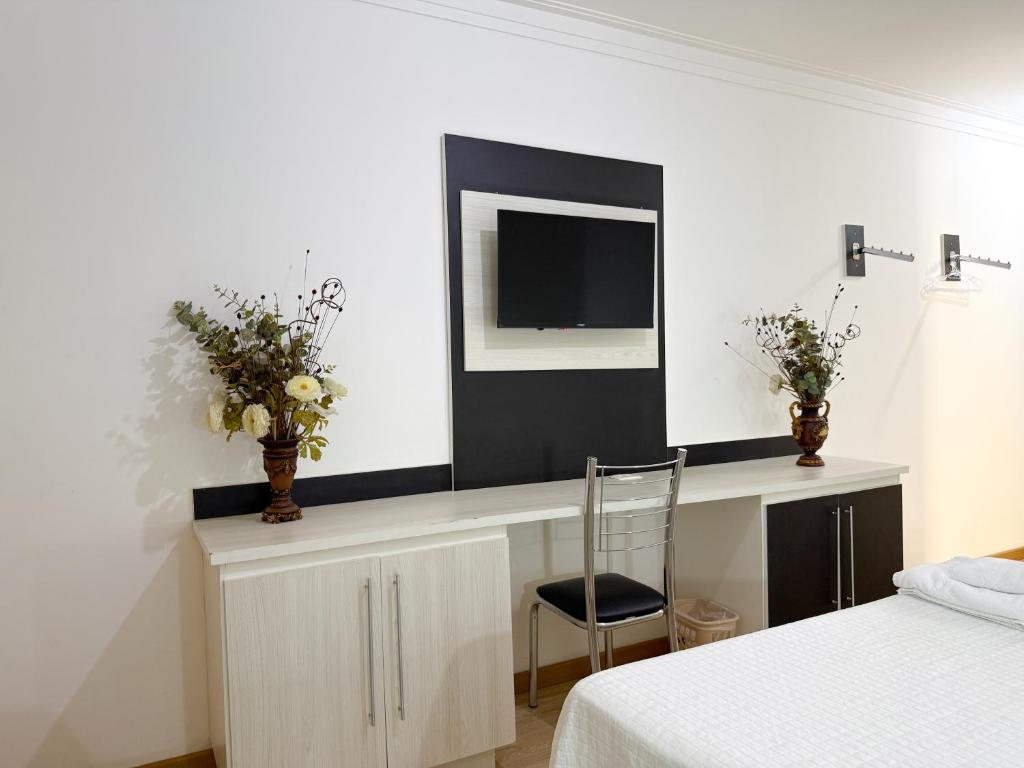 TV a/nebo společenská místnost v ubytování Grande Hotel