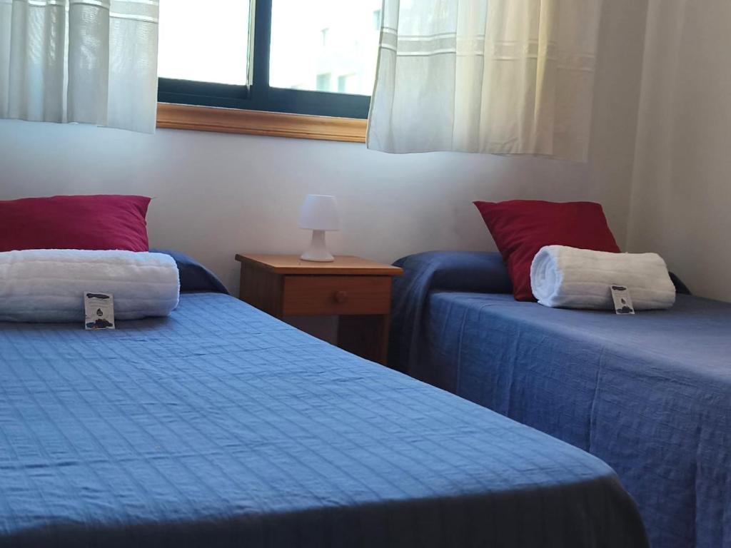 Postel nebo postele na pokoji v ubytování Holibai Orballo Apto funcional y económico para una estancia low cost