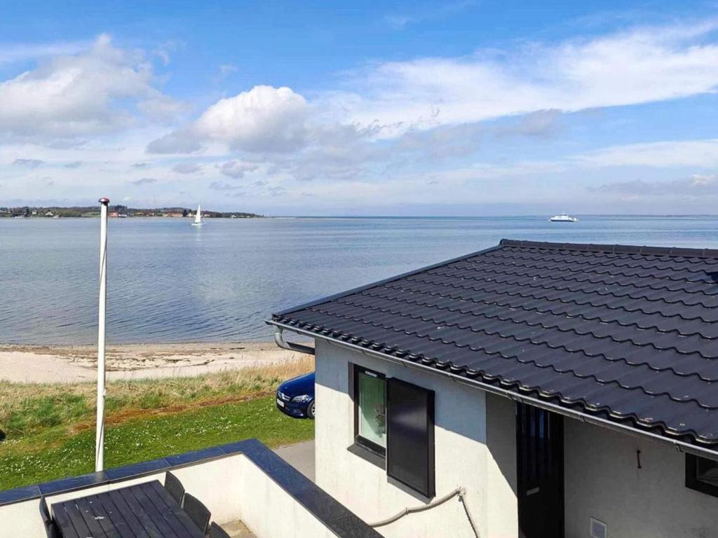 a house with a view of the water at 4 person holiday home in Farsø-By Traum in Farsø