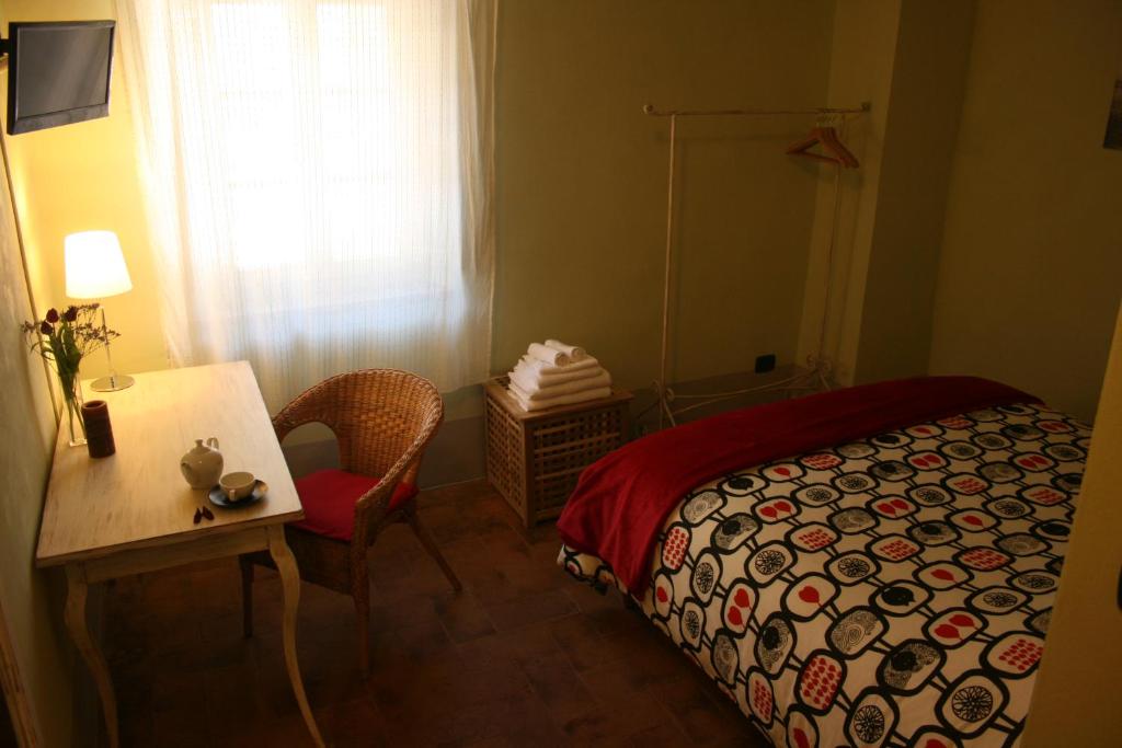 Postel nebo postele na pokoji v ubytování Scalette di Piazza B&B