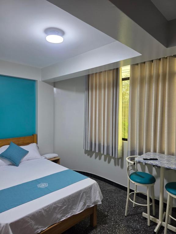 Postel nebo postele na pokoji v ubytování Hospedaje Kava