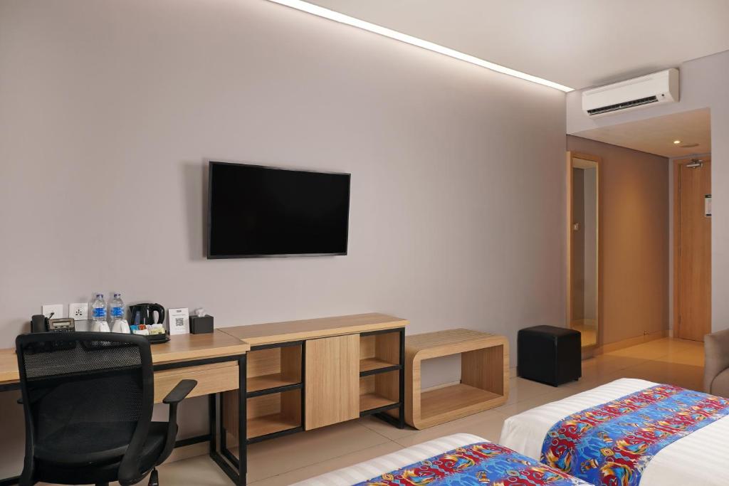 TV a/nebo společenská místnost v ubytování Best Western Sagita Hotel Jayapura