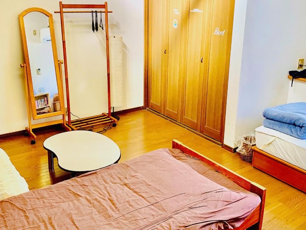 Postel nebo postele na pokoji v ubytování Guesthouse IKETA