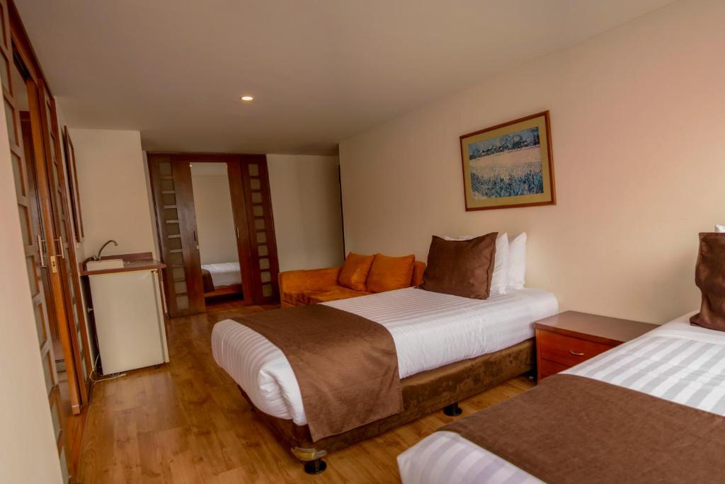 Postel nebo postele na pokoji v ubytování Hotel Confort 80 Zona Rosa