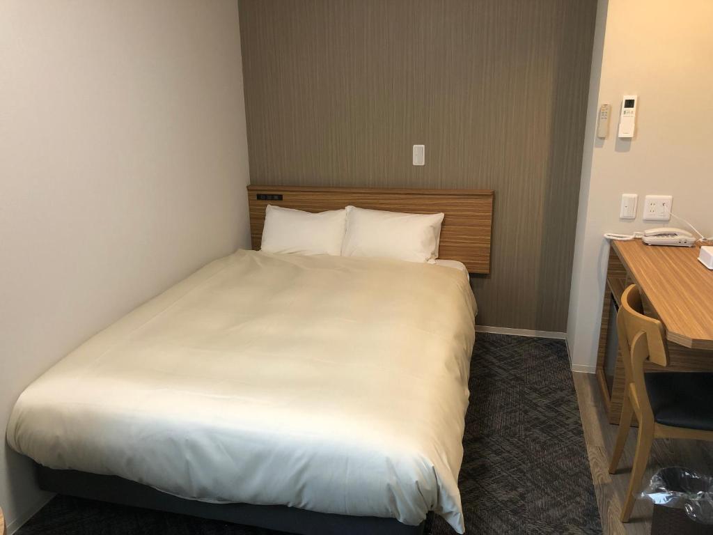 Postel nebo postele na pokoji v ubytování Hotel Crown Hills GOI